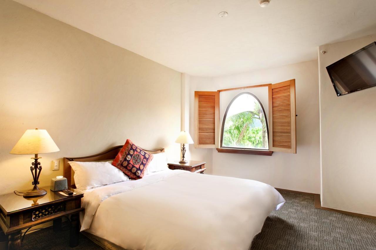 โพรมิสแลนด์ รีสอร์ท&ลากูน โซ่วเฟิง ภายนอก รูปภาพ A bedroom at the hotel