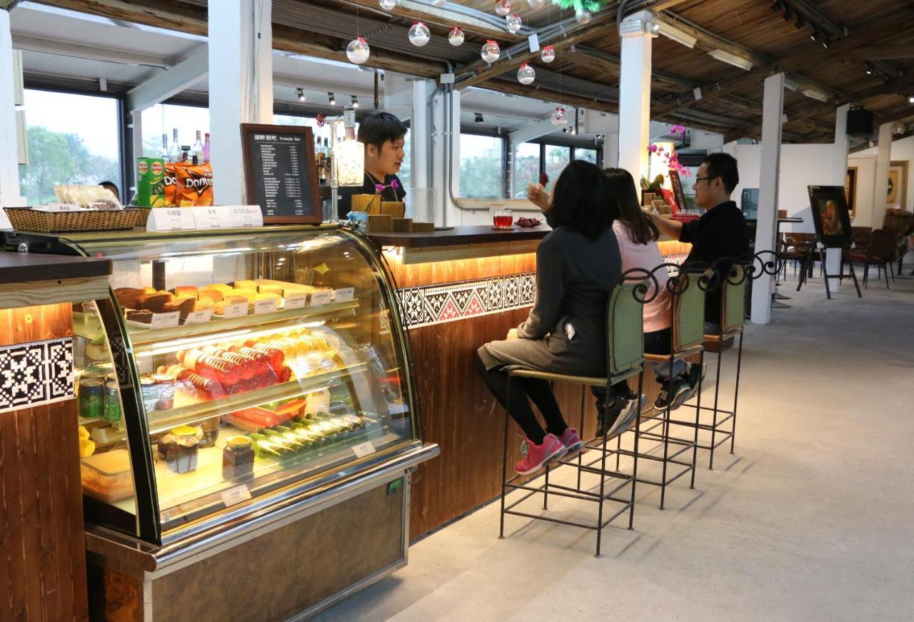 โพรมิสแลนด์ รีสอร์ท&ลากูน โซ่วเฟิง ภายนอก รูปภาพ A café in the lobby of the hotel